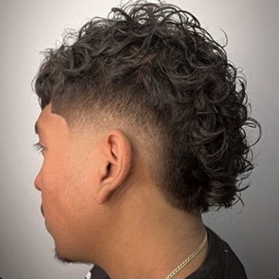 Burst fade from behind with the curls left long